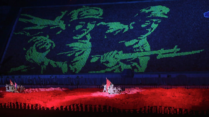 Illustration for article titled The Amazing, Colorful Flip Card Propaganda Mosaics of North Korea